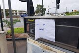 Note saying 'out of diesel' stuck onto a diesel pump at a petrol station