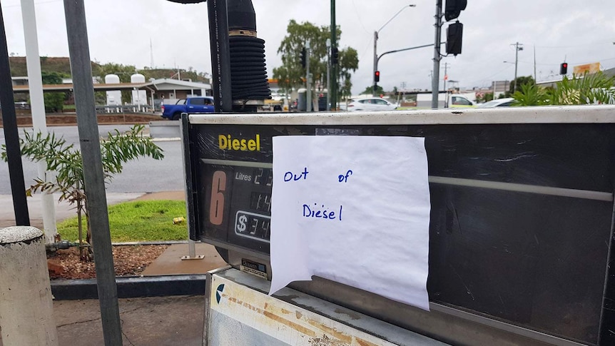 Note saying 'out of diesel' stuck onto a diesel pump at a petrol station