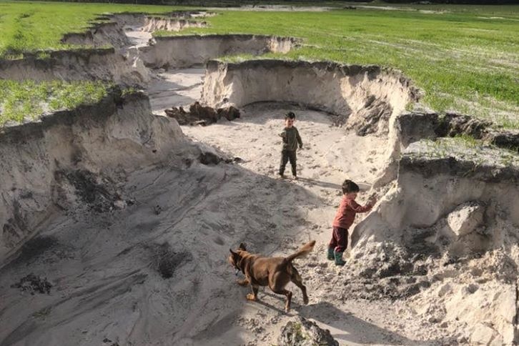 A big ditch carved out by wet weather.