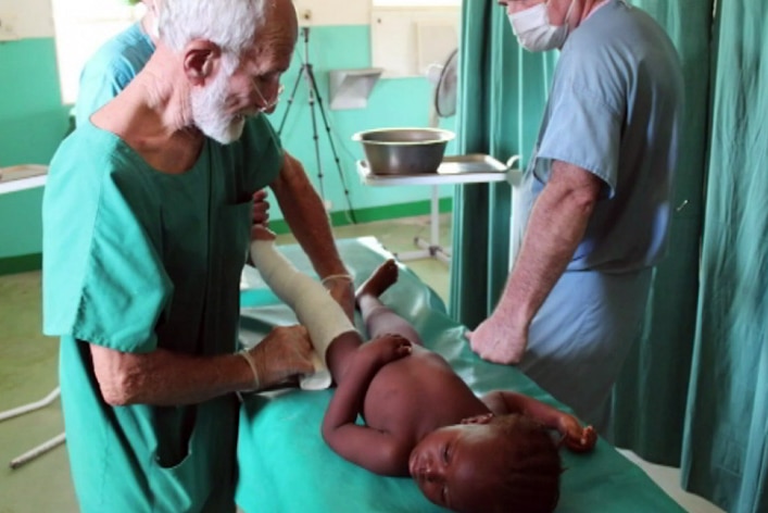 Dr Ken Elliott treats a patient in Burkina Faso