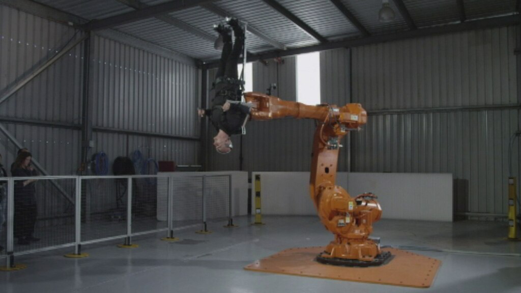 Perth artist Stelarc takes ride on 80,000 robotic arm in