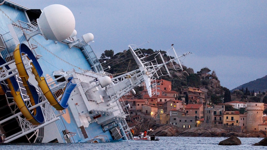 The capsized Costa Concordia cruise ship lying on its side at Giglio Island.