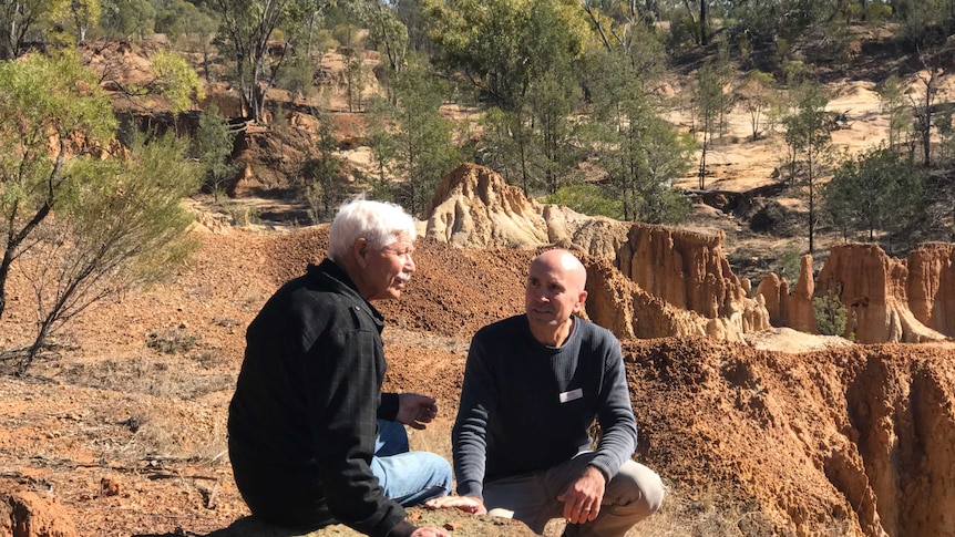 Uncle Sonny and Merv Sutherland talk at the Cathedral site in the Pilliga Forest.