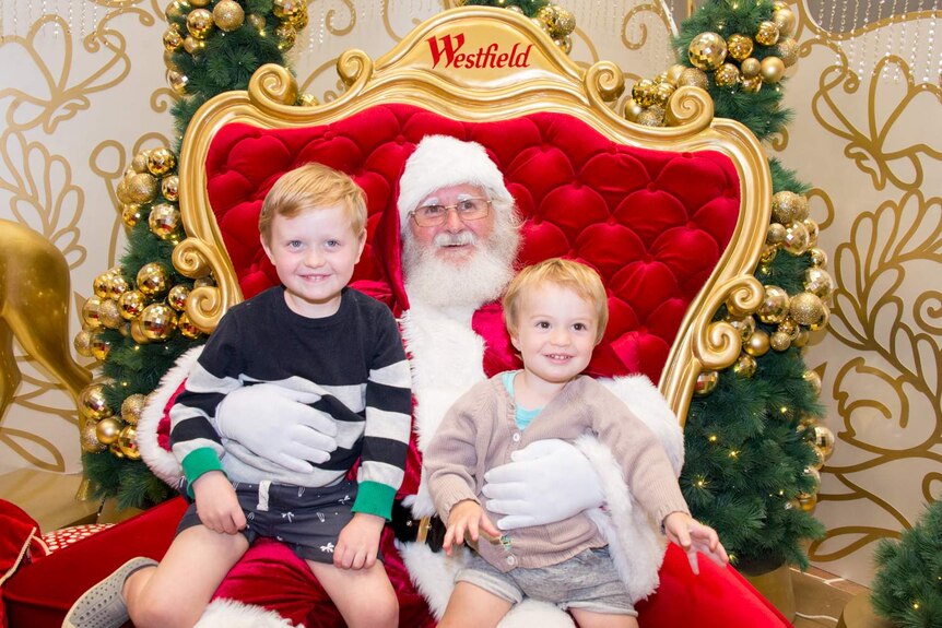 Two boys meet Santa Claus