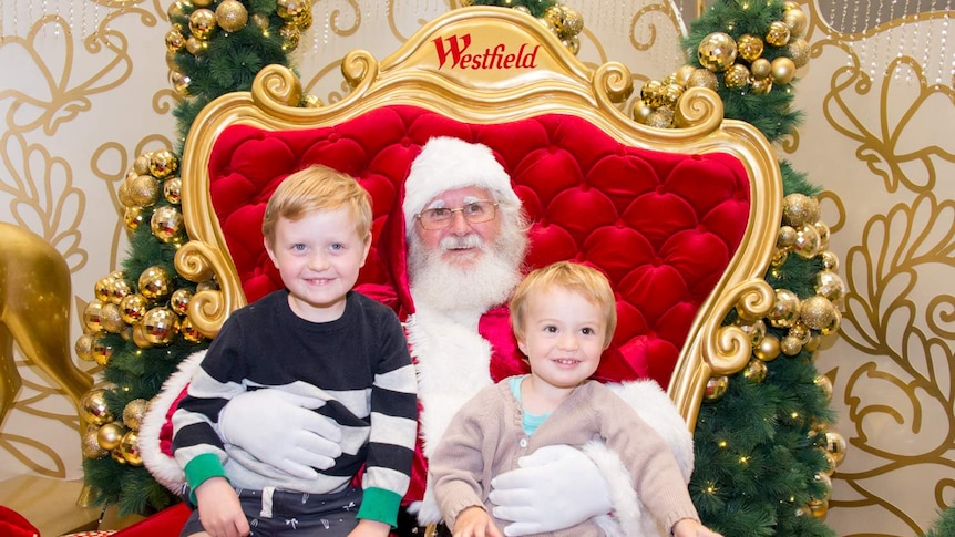 Two boys meet Santa Claus