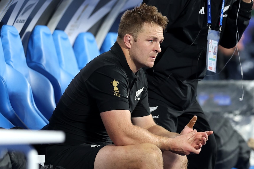 Sam Cane sits on the sidelines during Rugby World Cup final.