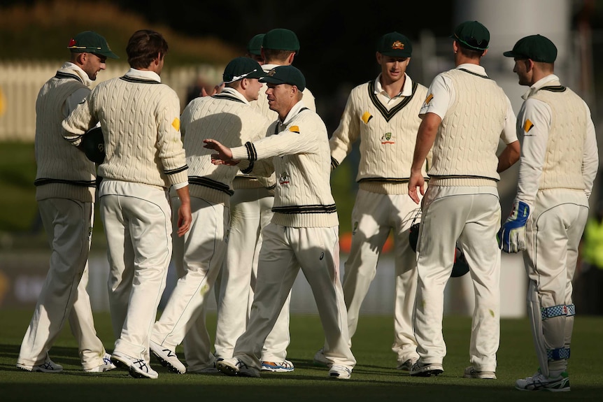 Australia gathers after play on day two in Hobart
