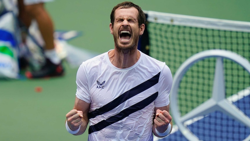 A tennis player closes his eye and roars in relief after winning a five-setter at the US Open.