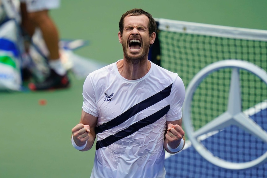 A tennis player closes his eye and roars in relief after winning a five-setter at the US Open.