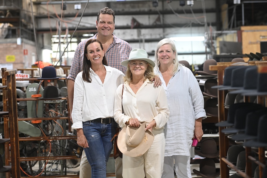 Nicola Forrest with Stephen Keir with his sisters Nikki McLeod and Stacey McIntyre in the Kempsey Akubra hat factory.