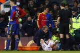 Gareth Bale from Tottenham Hotspur receives treatment for an ankle injury at White Hart Lane.