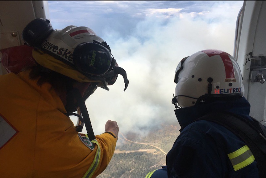 An aerial response team surveys the land under threat.