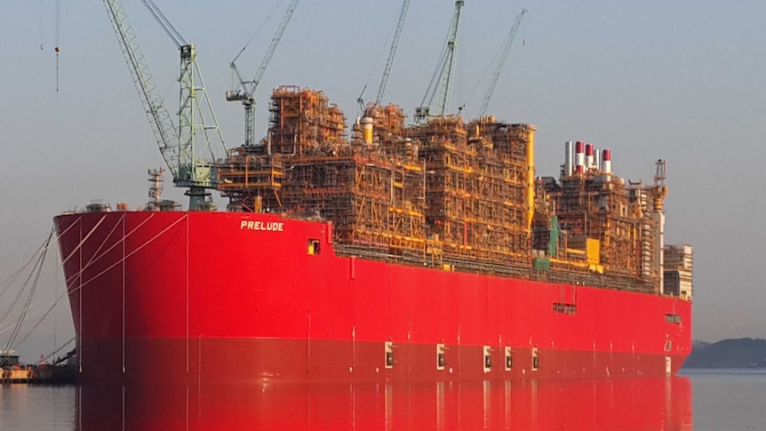 A large red ship in the water.