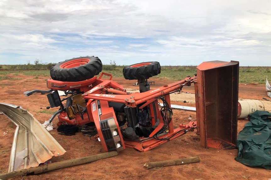 A tractor lies on it's side after a storm struck the Bawoorooga Community.