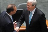 Tony Abbott shakes hands with Kevin Rudd.