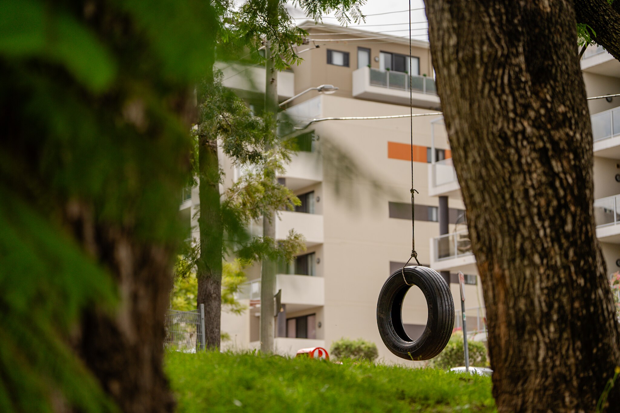 Apartment building with swing