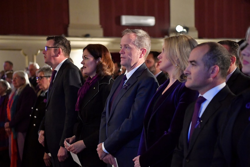 Daniel Andrews, Sarah Henderson, Bill Shorten and Matthew Guy stand at a memorial for Fiona Richardson.