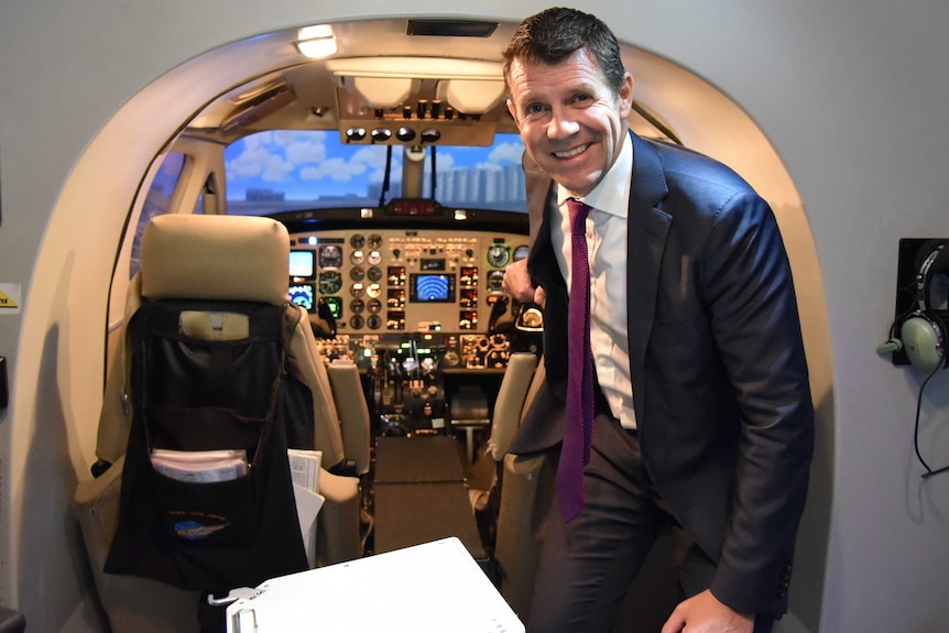 Premier Mike Baird inside a flight simulator