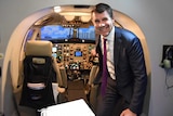 Premier Mike Baird inside a flight simulator