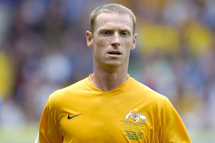 A Socceroos player running during a match at the 2006 FIFA World Cup in Germany.
