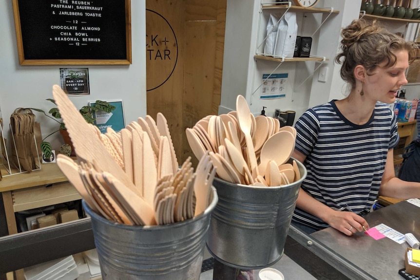 Wooden cutlery on the counter of an Adelaide cafe.