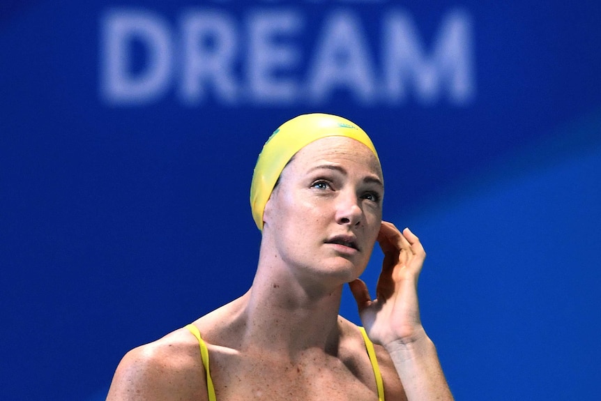 Cate Campbell looks up into the stands at an Australian training session on the Gold Coast.