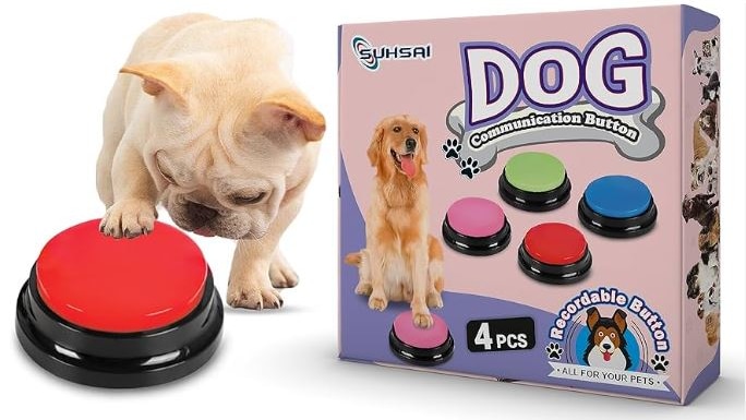 a small white dog with it's paw on a red button next to pink box with dog and buttons printed on it