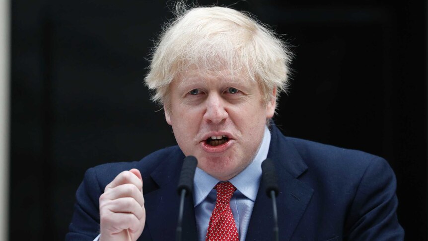 British Prime Minister Boris Johnson gestures as he makes a statement on his first day back at work.