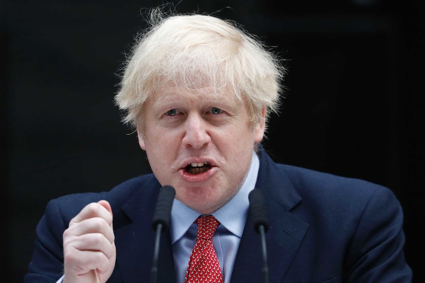 British Prime Minister Boris Johnson gestures as he makes a statement on his first day back at work.