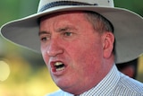 A close up of Barnaby Joyce speaking he is wearing a grey brimmed hat