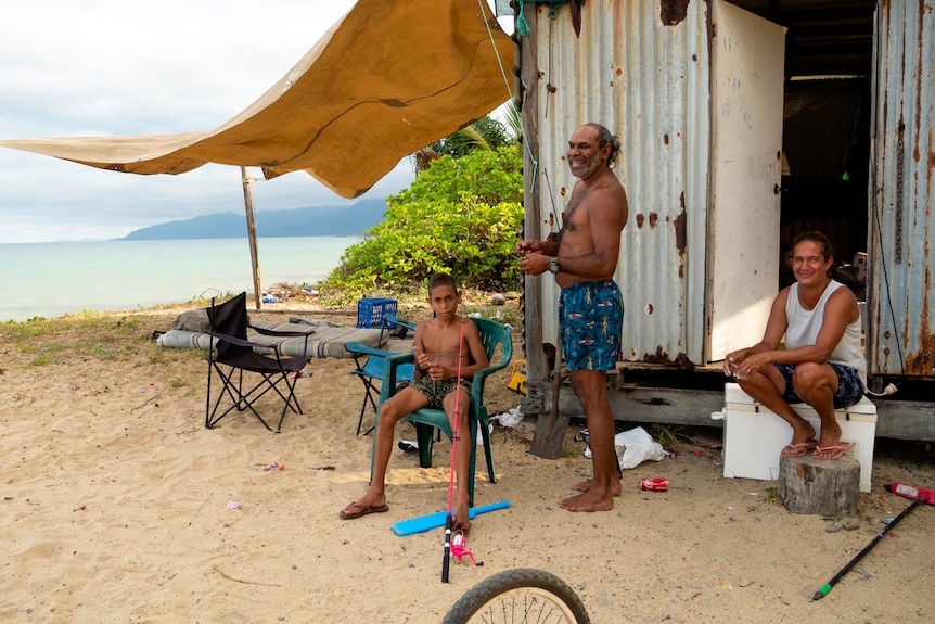 A corrugated iron shack on the beach.