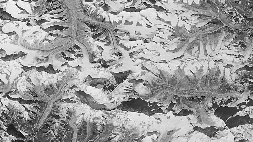 A black and white image of glaciers spreading out over the Himalayas.