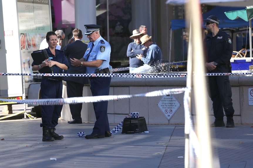Police gather at the scene of police shooting at a Hornsby shopping centre