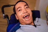 A composite picture of five people living in disability housing.