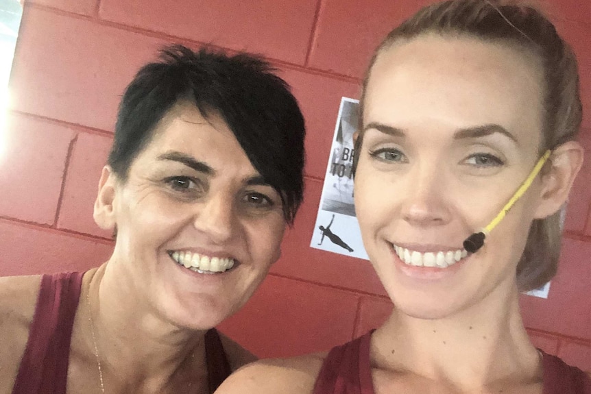 Fitnessworks NT staff member Cindy Callander and owner Chloe Scheppard smiling in gym gear inside
