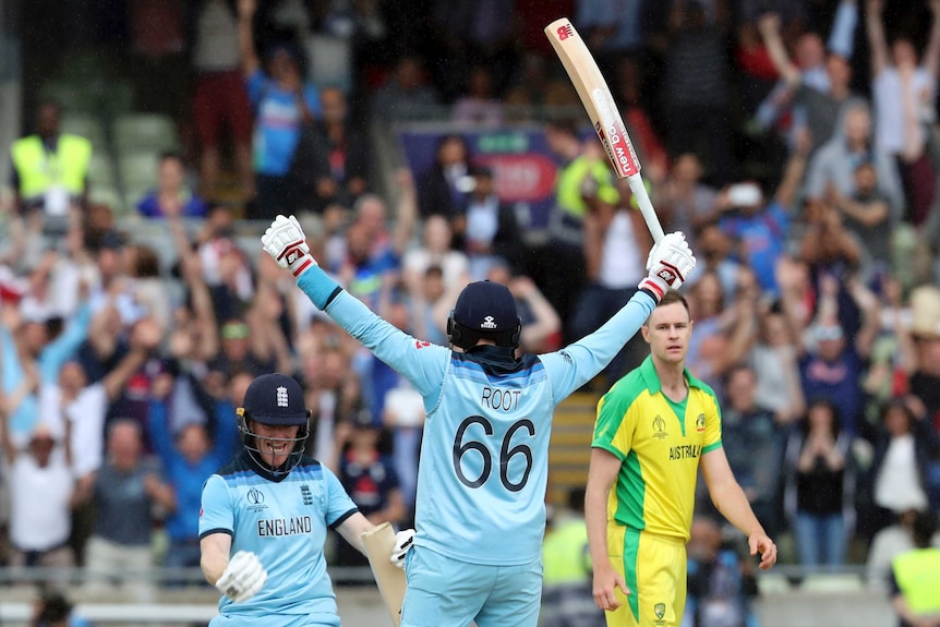 England's Joe Root and Eoin Morgan celebrate their Cricket World Cup semi-final win over Australia. Jason Behrendorff looks on.