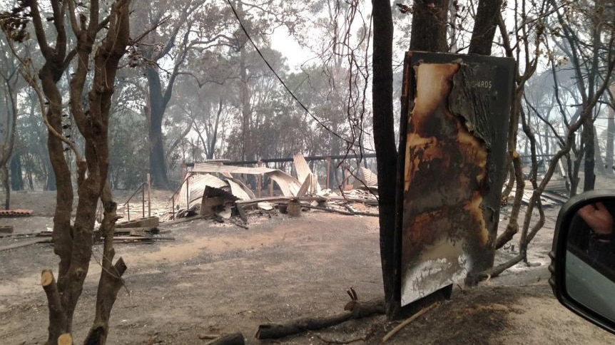 Remnants of burnt houses after bushfires burnt through Mallacoota last summer