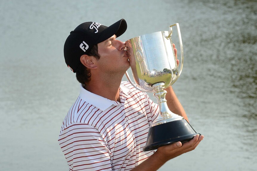 Dream come true ... Daniel Popovic celebrates with the Australian PGA Championship trophy.