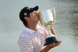 Daniel Popovic holds the Kirkwood Cup after winning the Australian PGA title.