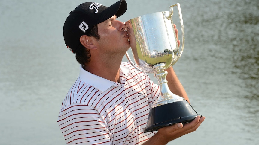 Daniel Popovic kisses the Kirkwood Cup after winning the Australian PGA title.