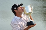 Daniel Popovic holds the Kirkwood Cup after winning the Australian PGA title.