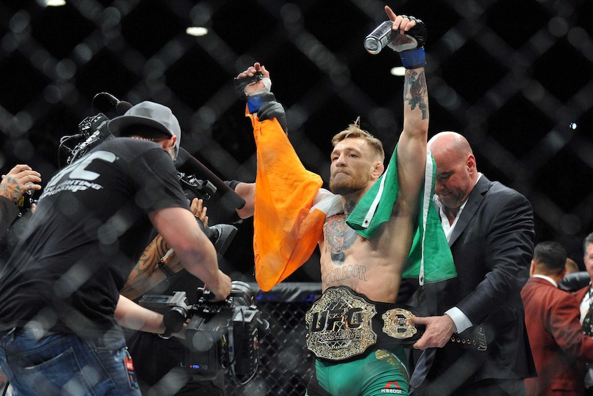 Conor McGregor is crowned the UFC featherweight champion