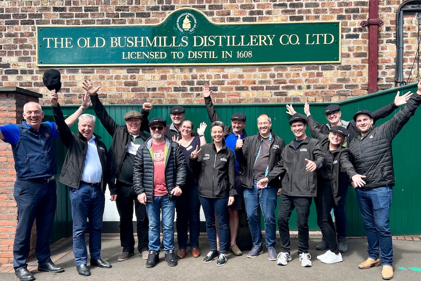 a group of people at a distillery