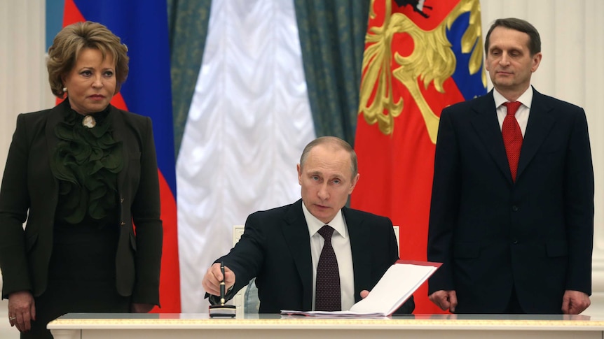 Russian president Vladimir Putin signs law completing Crimea annexation