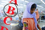 Workers sort clothes at a garment factory in Bangladesh overlayed with grades A, B, C, D.