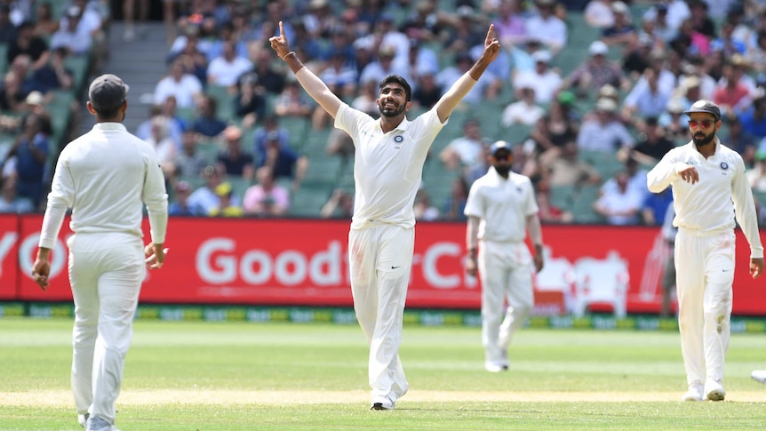 India bowler Jasprit Bumrah points both hands to the sky as he celebrates a wicket during a Test against Australia at the MCG.