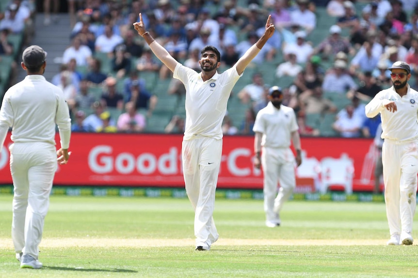 India bowler Jasprit Bumrah points both hands to the sky as he celebrates a wicket during a Test against Australia at the MCG.