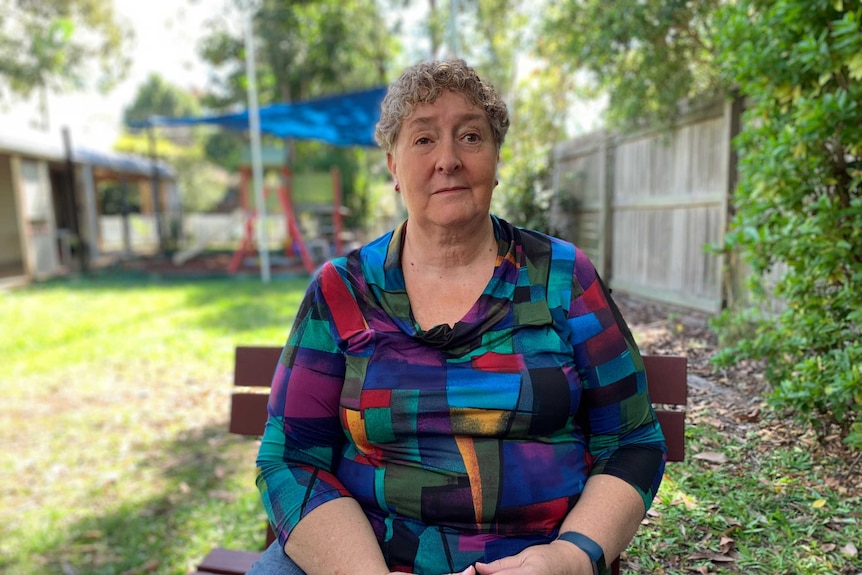 Brisbane psychologist Coral Palme, seated at a park outside her counselling clinic.