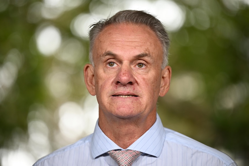 Close-up of man with light blue shirt 