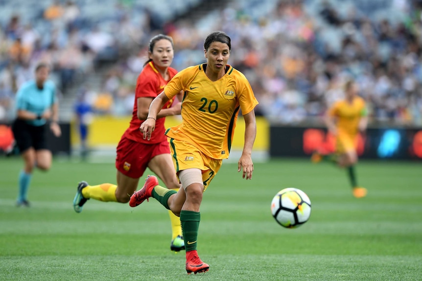 Sam Kerr of the Matildas on the ball against China